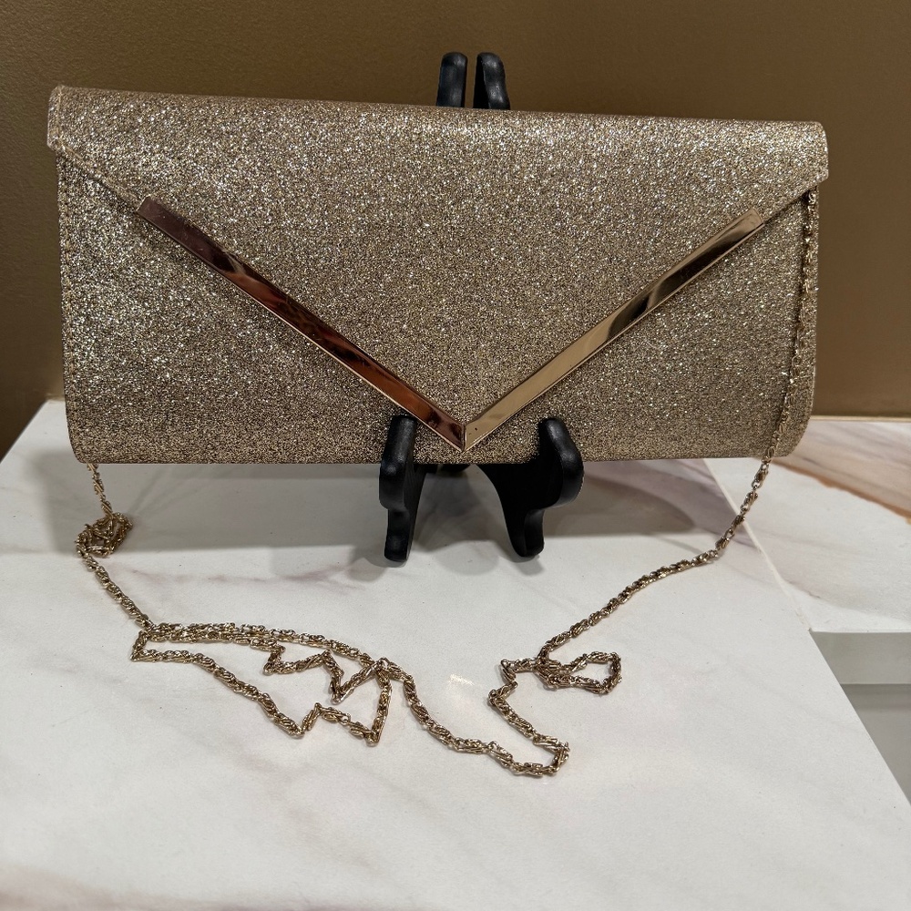 SPRING gold metallic clutch with strap, excellent condition